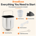 Included BreadEase bread maker pan, cup, paddle, spoon and removal hook